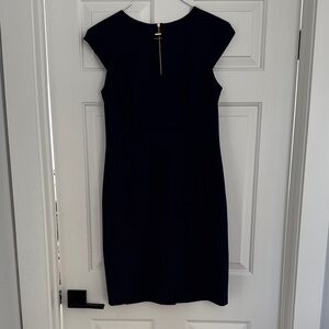 Tahari Navy Sheath Dress with Gold Zip Detail down back. Fully lined. Size 6